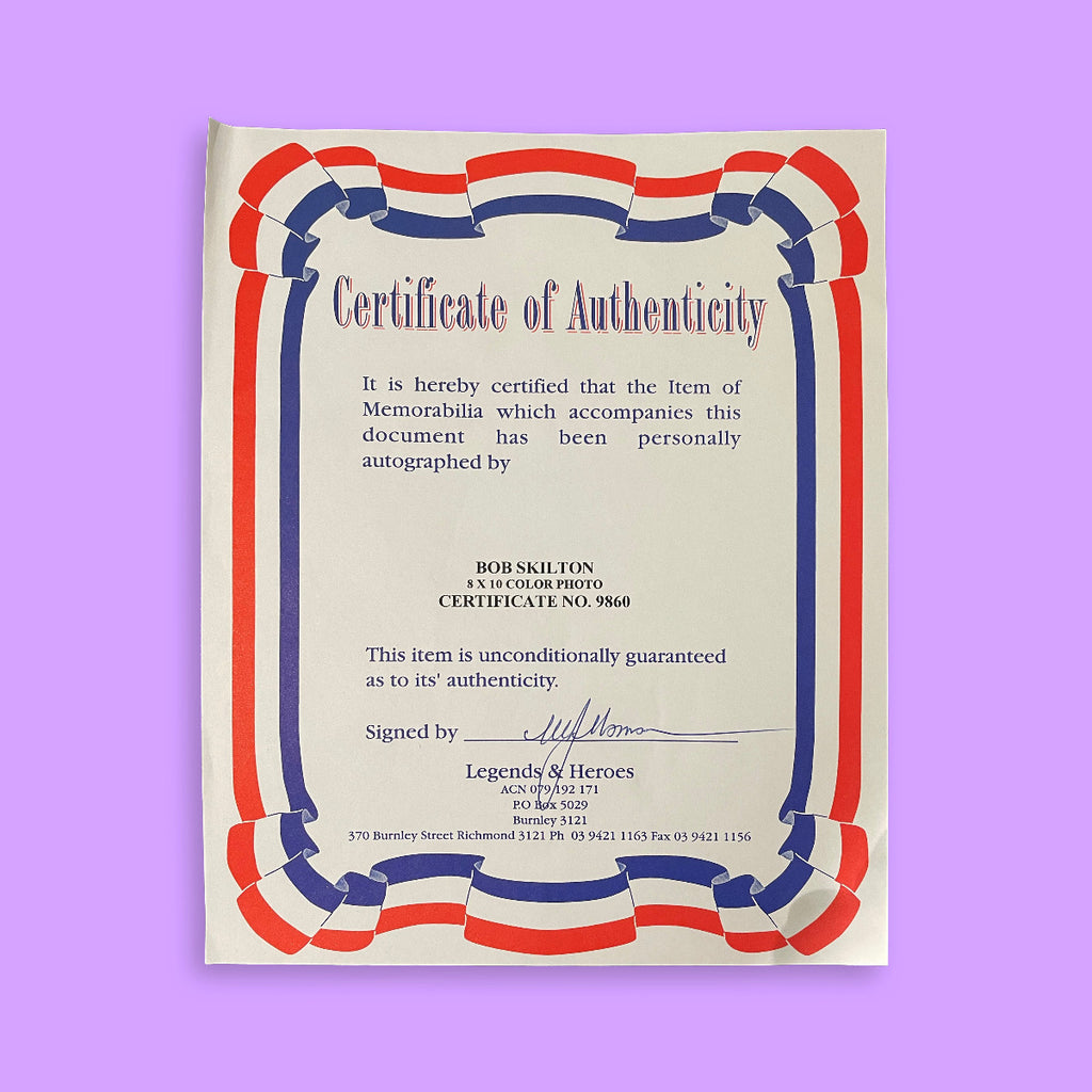 Certificate of Authenticity with red, white, and blue border on a purple background