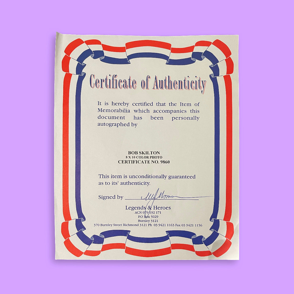 Certificate of Authenticity with red, white, and blue border on a purple background