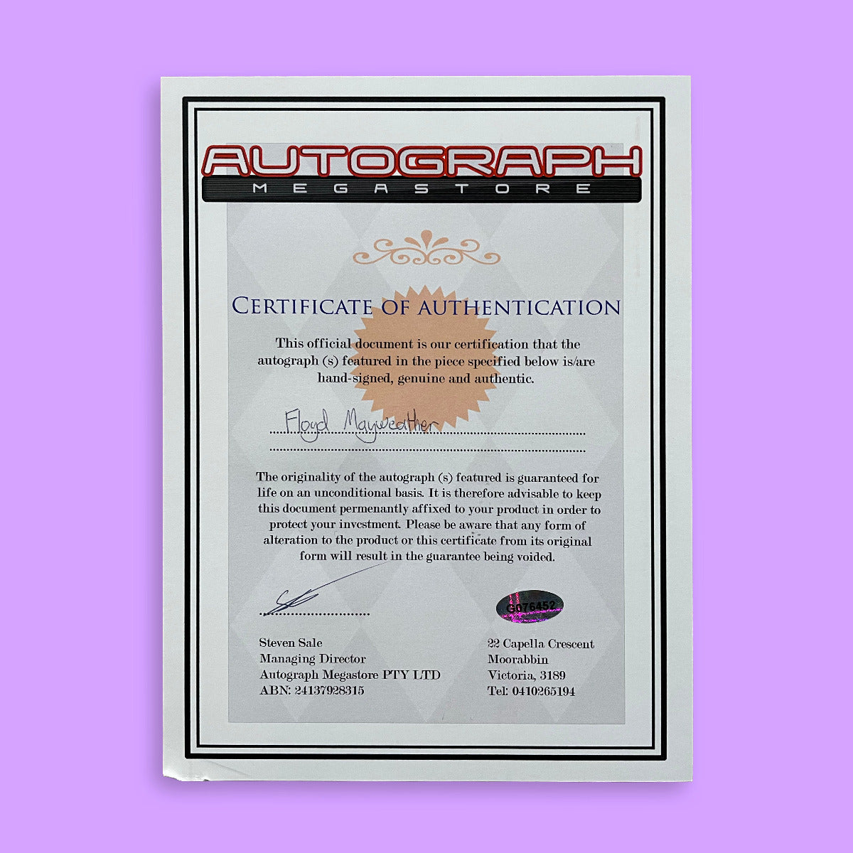 Certificate of Authentication from Autograph Megastore on a purple background
