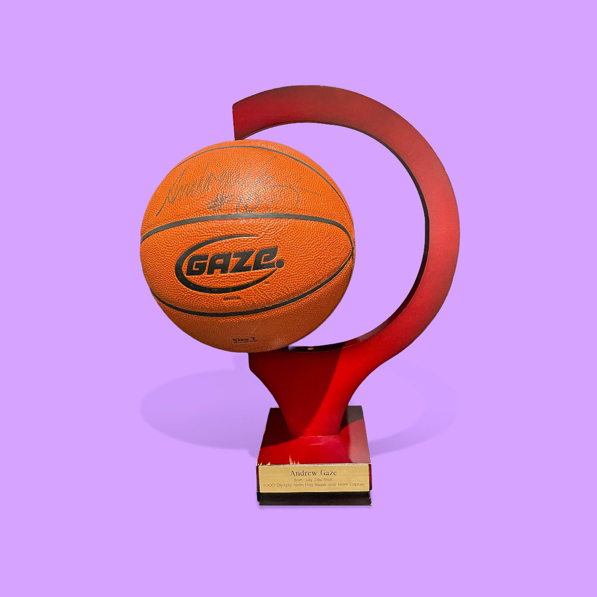Basketball on a red stand with 'Gaze' branding against a purple background