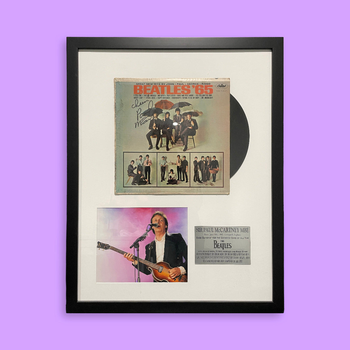 Framed Beatles album cover with a purple background
